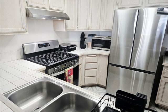 12864 Sycamore Village Dr., Norwalk, CA 90650 — photo 12 of 34
